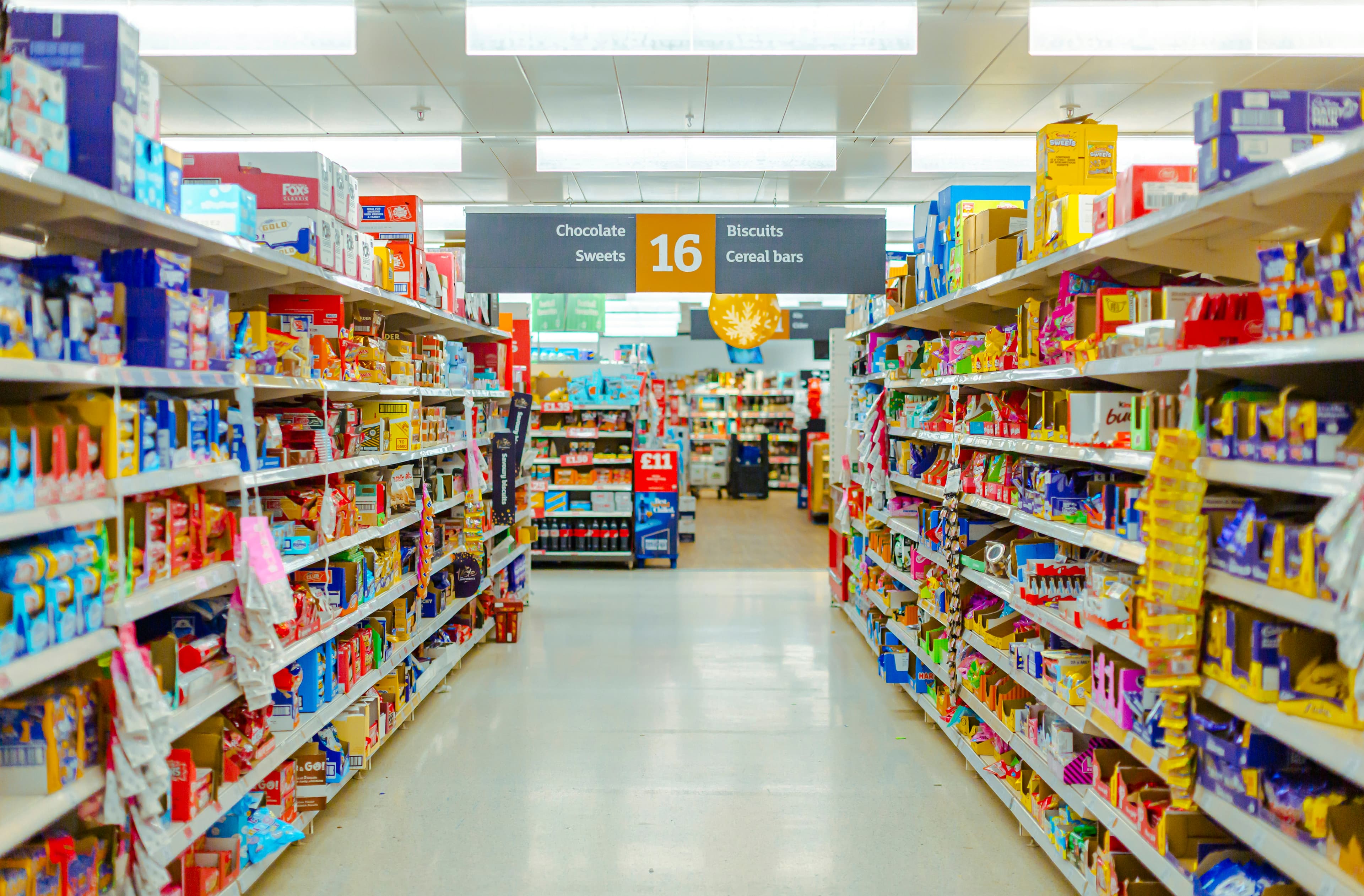 Selves of snacks in a supermarket. London, UK.